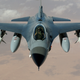 A heavily armed F-16 Fighting Falcon from the 35th Fighter Wing “Wild Weasels” approaches an aerial tanker in the skies over Iraq during Operation Iraqi Freedom in 2003. (US Air Force)